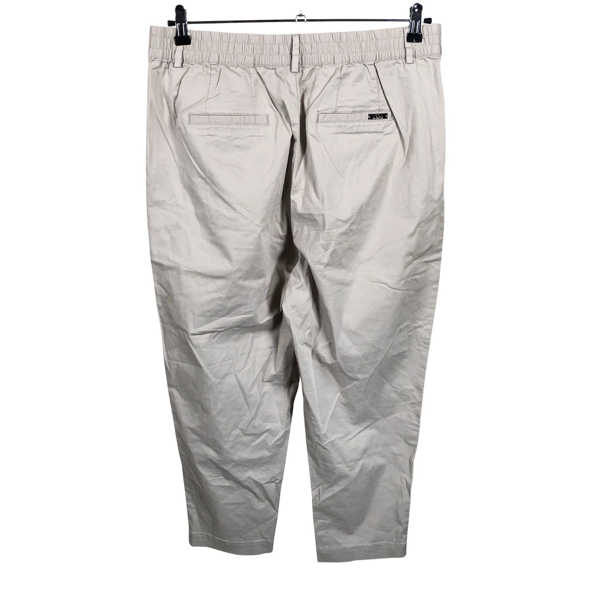 Unisex Noom - Mittevenivad poolpikad püksid, suurus 42 - Beige (2)