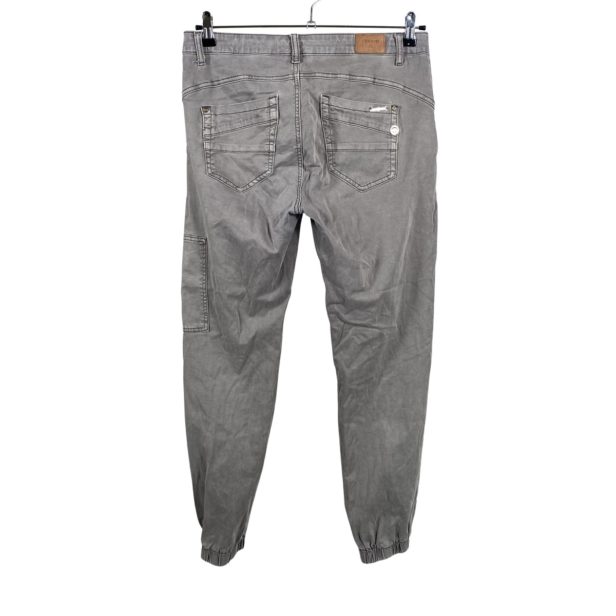 Unisex Cream - Mittevenivad püksid, suurus W31 - Hall (2)