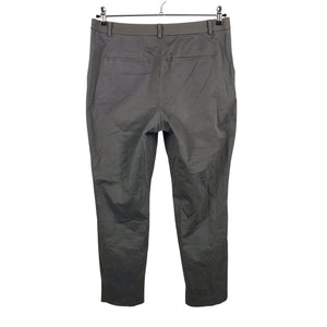 Unisex Uniqlo - Mittevenivad püksid, suurus 40 - Pruun (2)