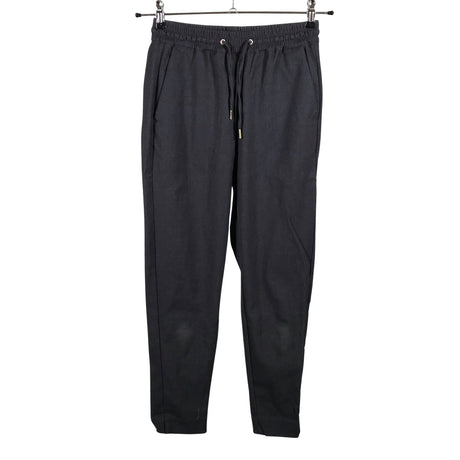 Unisex Holly & Whyte by Lindex - Mittevenivad püksid, suurus 34 - Hall ()