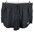 Unisex New Balance - Lühikesed spordipüksid, suurus XL - Must ()