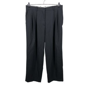 Unisex COS - Mittevenivad püksid, suurus 42 - Must (1)