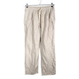 Unisex Uniqlo - Mittevenivad püksid, suurus 40 - Beige ()
