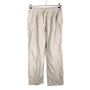 Unisex Uniqlo - Mittevenivad püksid, suurus 40 - Beige (1)