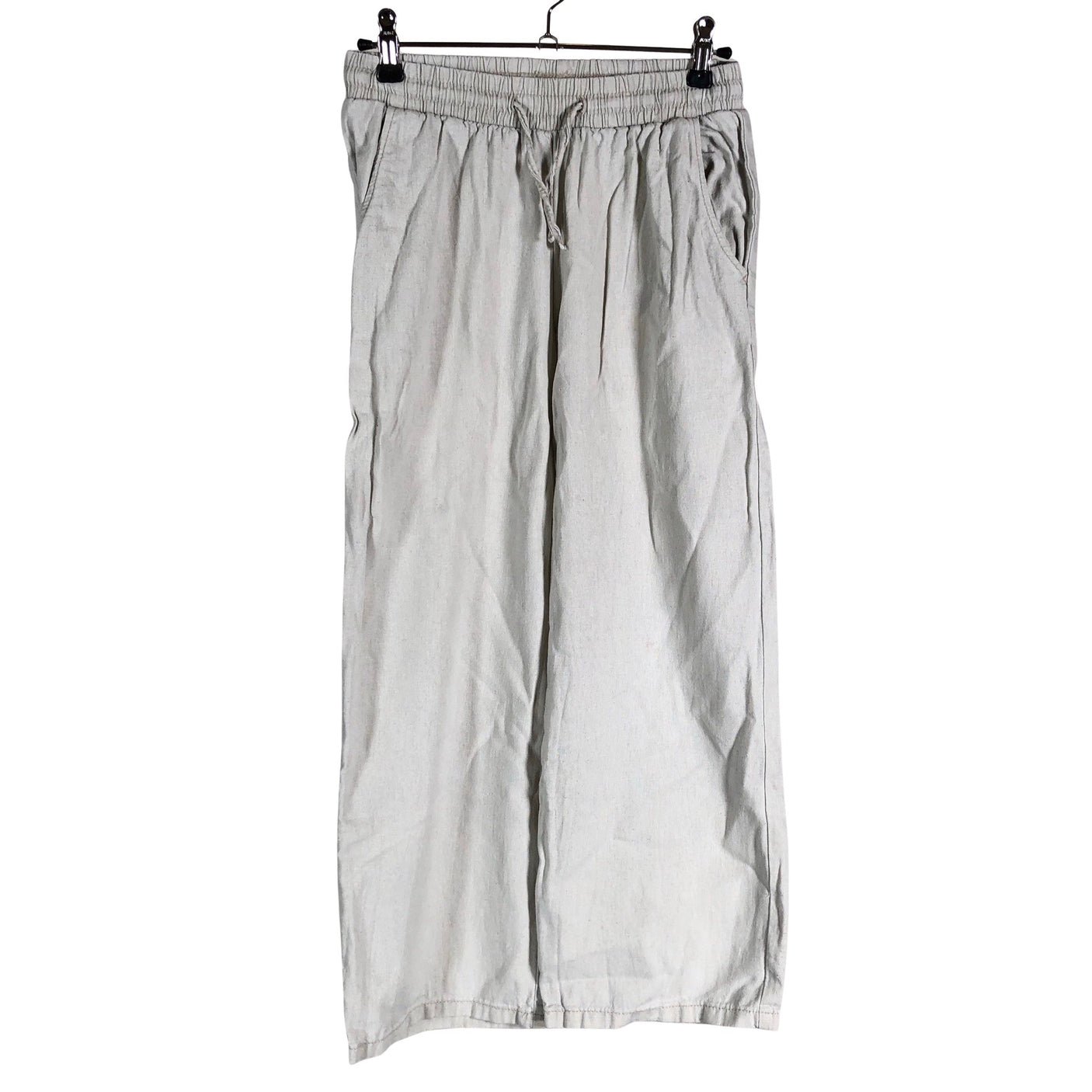 Unisex Lindex - Mittevenivad püksid, suurus 134 - 140 - Beige (1)