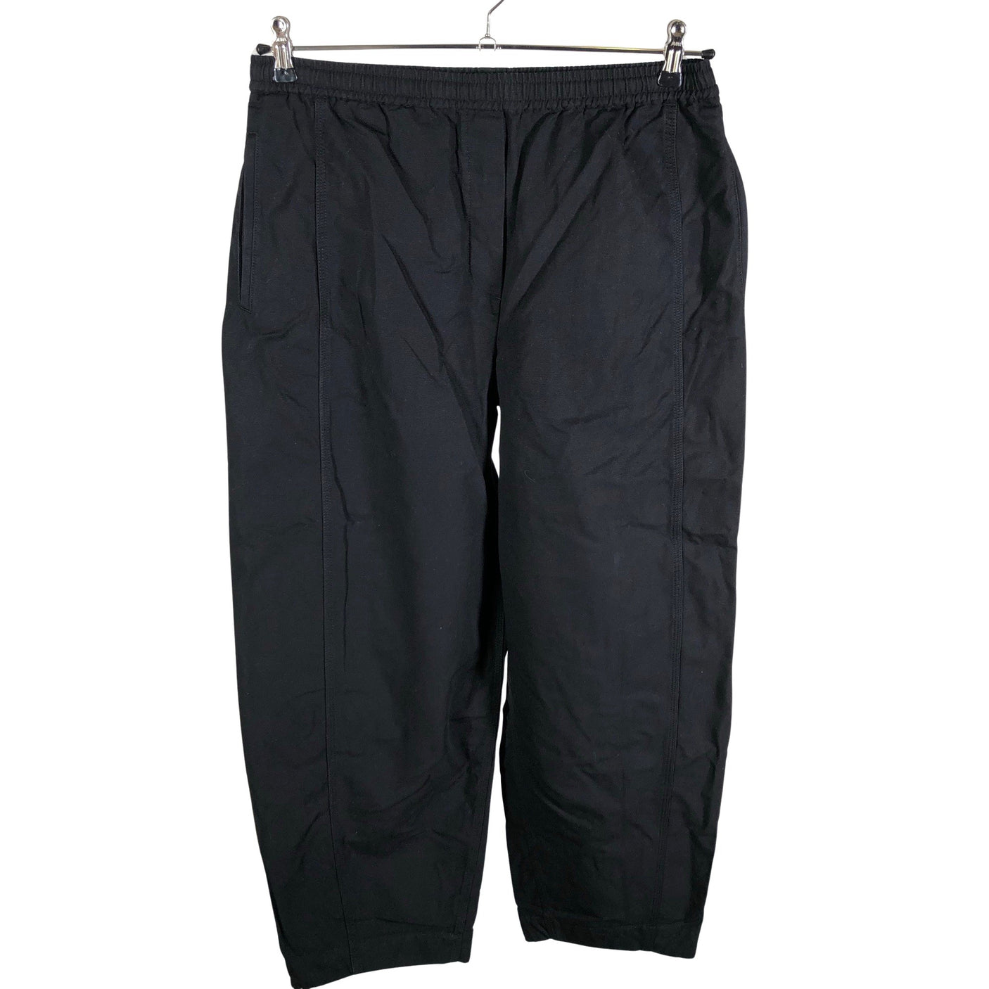 Unisex COS - Mittevenivad püksid, suurus 38 - Must (1)