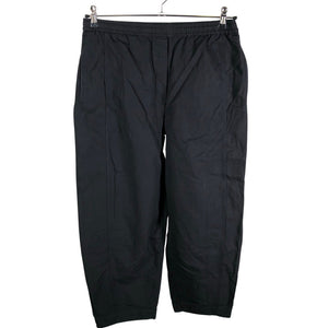 Unisex COS - Mittevenivad püksid, suurus 38 - Must (1)