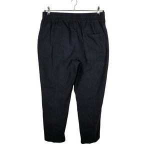Unisex Puma - Mittevenivad püksid, suurus L - Must (2)