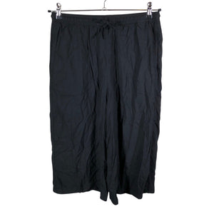 Unisex Uniqlo - Mittevenivad poolpikad püksid, suurus 38 - Must (1)