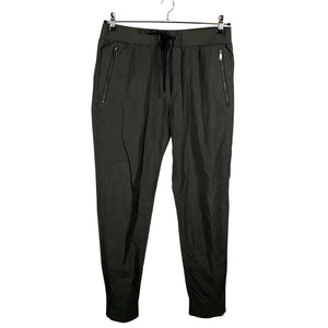 Unisex COS - Mittevenivad püksid, suurus M - Roheline (1)