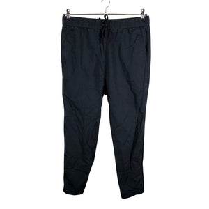 Unisex COS - Mittevenivad püksid, suurus 40 - Must (1)
