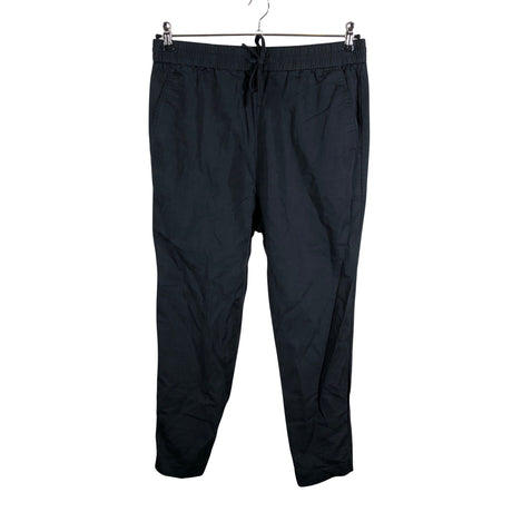 Unisex COS - Mittevenivad püksid, suurus 40 - Must ()