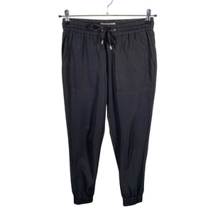 Unisex Noom - Mittevenivad püksid, suurus 34 - Must (1)
