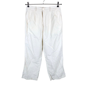 Unisex Uniqlo - Mittevenivad püksid, suurus 38 - Beige (1)