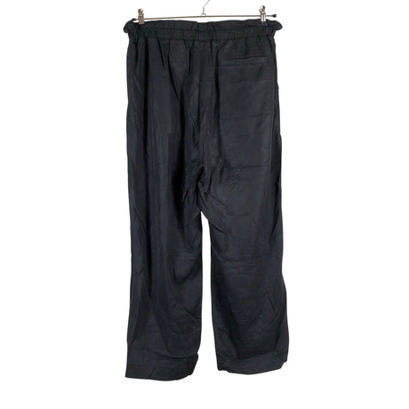 Unisex Arket - Mittevenivad püksid, suurus 42 - Must (2)
