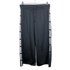 Unisex Reebok - Soojenduspüksid, suurus 42 - Must (1)