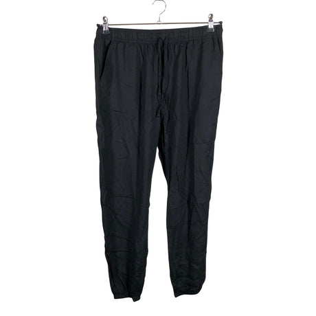 Unisex Uniqlo - Mittevenivad püksid, suurus 40 - Must ()