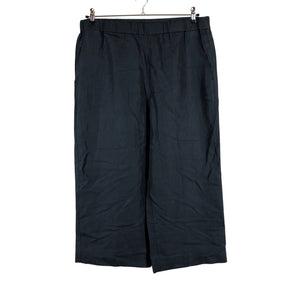 Unisex COS - Mittevenivad poolpikad püksid, suurus 44 - Must (1)