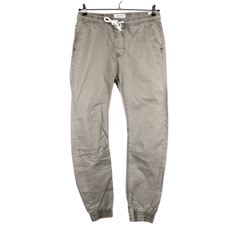 Unisex House Brand - Mittevenivad püksid, suurus 38 - Beige ()