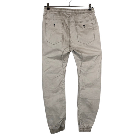 Unisex House Brand - Mittevenivad püksid, suurus 38 - Beige (2)