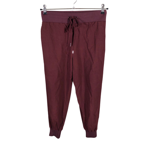 Unisex COS - Mittevenivad püksid, suurus 34 - Veinipunane ()