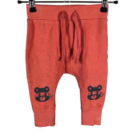Unisex Huxbaby - Trikotaažist püksid, suurus 92 - 98 - Oranž ()