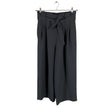 Unisex COS - Mittevenivad püksid, suurus 36 - Must ()