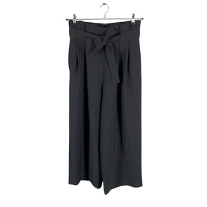 Unisex COS - Mittevenivad püksid, suurus 36 - Must (1)