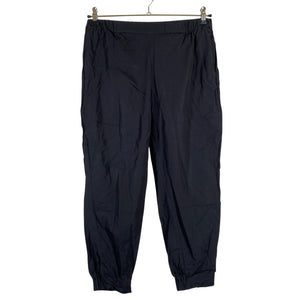 Unisex COS - Mittevenivad püksid, suurus 38 - Must (1)