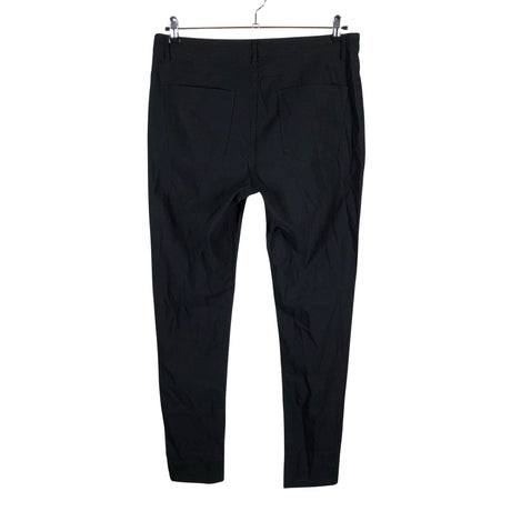 Unisex O.I.S - Mittevenivad püksid, suurus 46 - Must (2)