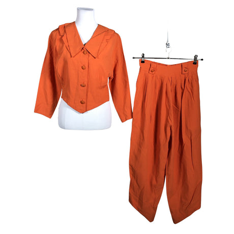 Unisex Petuliina - Mittevenivad püksid, suurus 38 - Oranž ()