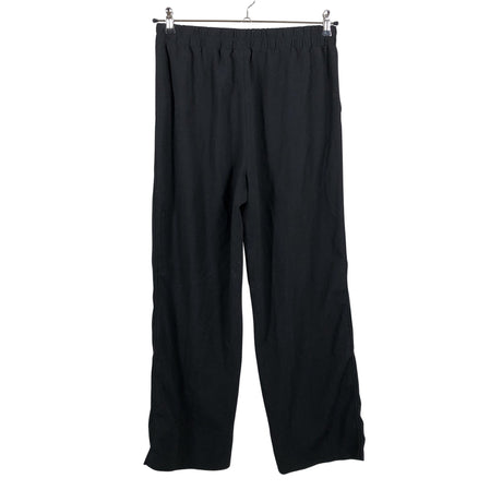 Unisex Ganni - Mittevenivad püksid, suurus 38 - Must (2)