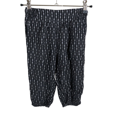 Unisex Lindex - Mittevenivad poolpikad püksid, suurus 104 - 110 - Must ()