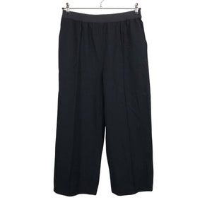 Unisex Arket - Mittevenivad püksid, suurus 42 - Must (1)