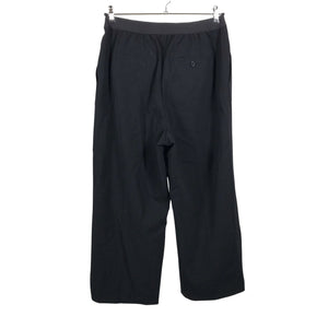Unisex Arket - Mittevenivad püksid, suurus 42 - Must (2)