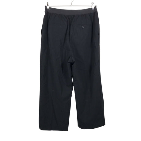 Unisex Arket - Mittevenivad püksid, suurus 42 - Must (2)
