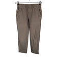 Unisex Uniqlo - Mittevenivad püksid, suurus 36 - Pruun ()