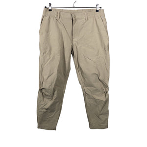Unisex Adidas - Mittevenivad püksid, suurus W34 - Beige (1)