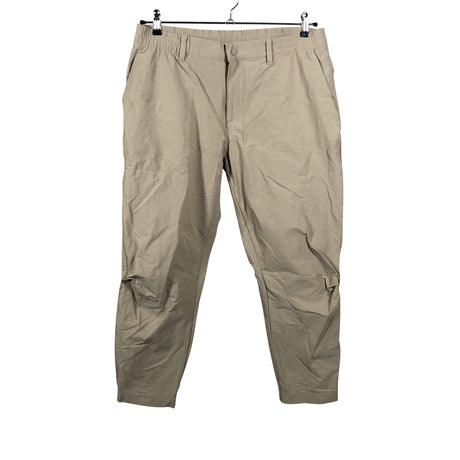 Unisex Adidas - Mittevenivad püksid, suurus W34 - Beige ()