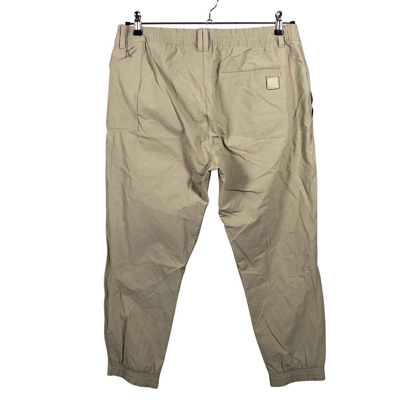Unisex Adidas - Mittevenivad püksid, suurus W34 - Beige (2)