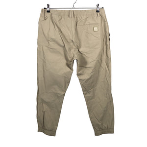 Unisex Adidas - Mittevenivad püksid, suurus W34 - Beige (2)