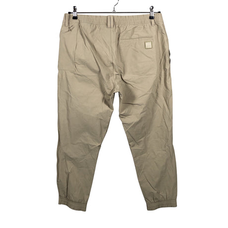 Unisex Adidas - Mittevenivad püksid, suurus W34 - Beige (2)