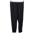 Unisex Adidas - Dressikangast püksid, suurus L - Must ()