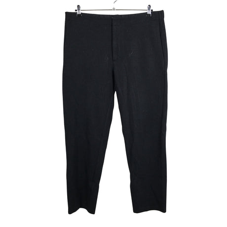 Unisex COS - Mittevenivad püksid, suurus XL - Must ()