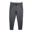 Unisex Noom - Mittevenivad püksid, suurus 38 - Hall ()