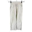Unisex Lindex - Mittevenivad püksid, suurus 146 - 152 - Beige ()
