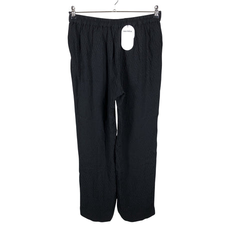 Unisex Aarikka - Mittevenivad püksid, suurus 38 - Must (2)