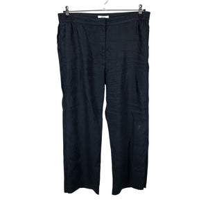 Unisex COS - Mittevenivad püksid, suurus 44 - Must (1)