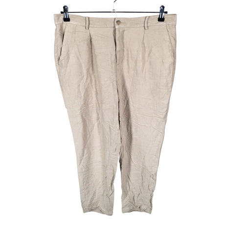 Unisex Noom - Mittevenivad püksid, suurus 44 - Beige ()