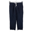 Unisex Uniqlo - Mittevenivad püksid, suurus 36 - Sinine ()